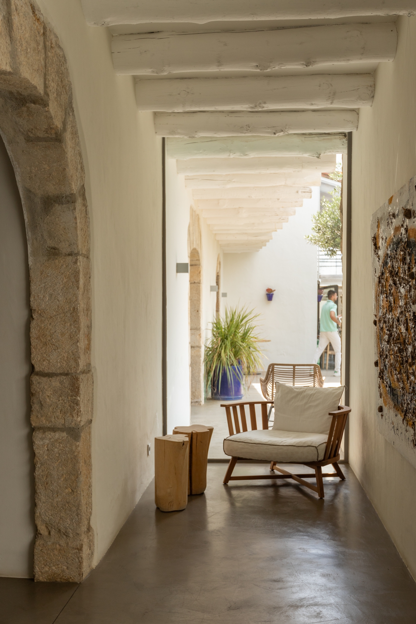 Interior photograph of a hotel in Spain, showcasing the elegant Japandi style with its harmonious blend of Japanese minimalism and Scandinavian functionality. The image features a serene living space with clean lines, natural wood furniture, and neutral tones, emphasizing the photographer's skill in capturing the beauty and tranquility of interior spaces.